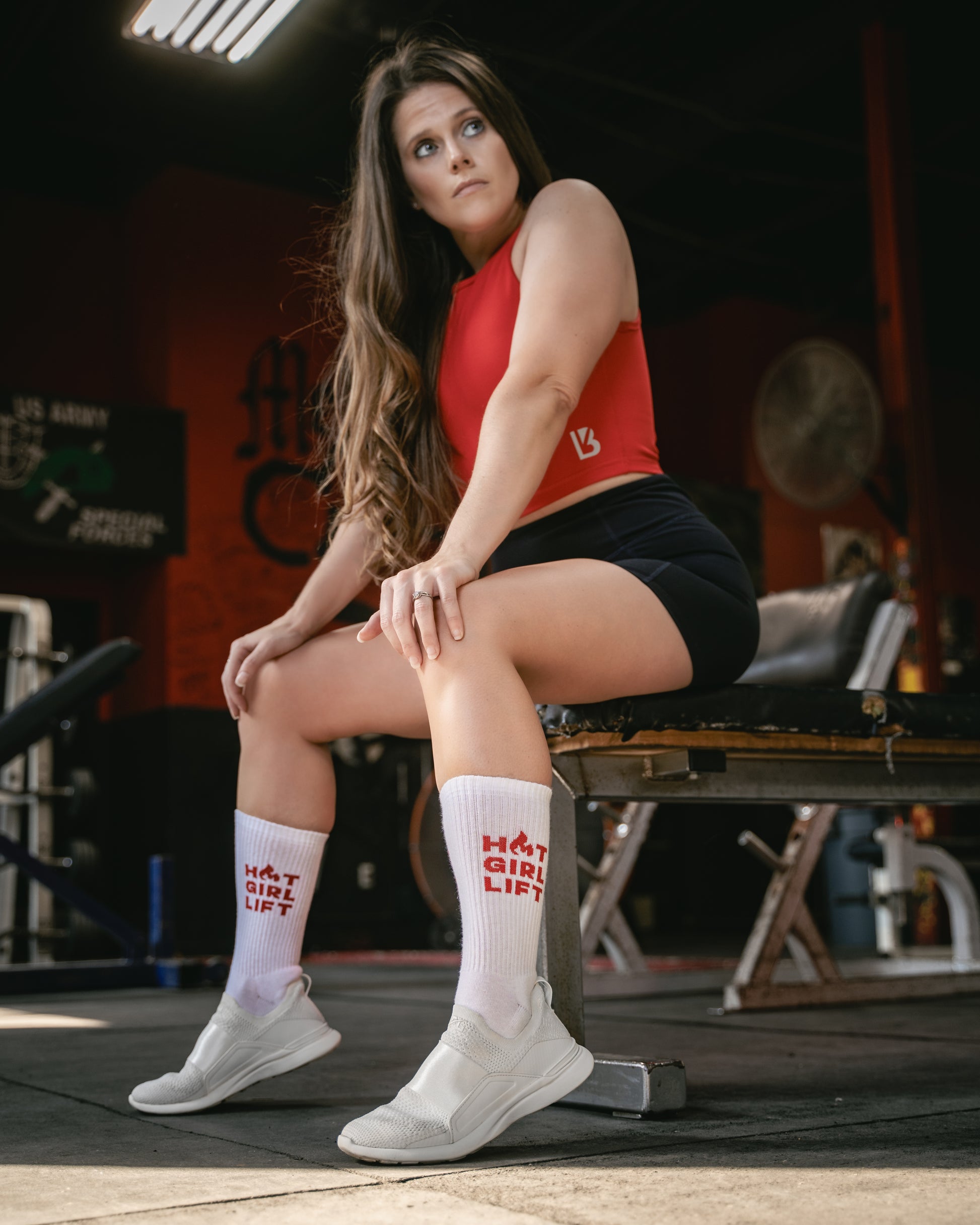 Hot Girl Lift Gym Crew Socks, posing on bench in the gym