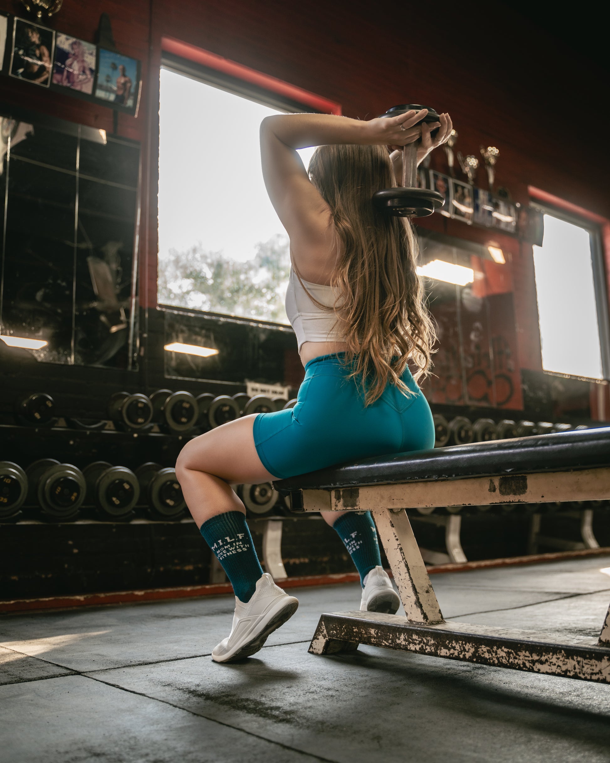 M.I.L.F Mom in Love with Fitness Gym Crew Socks, performing tricep extensions on bench