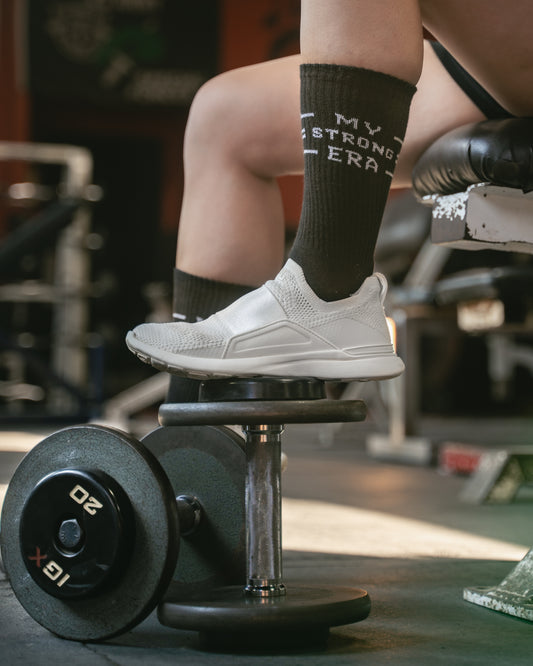Women’s gym socks with “My Strong Era” design during workout
